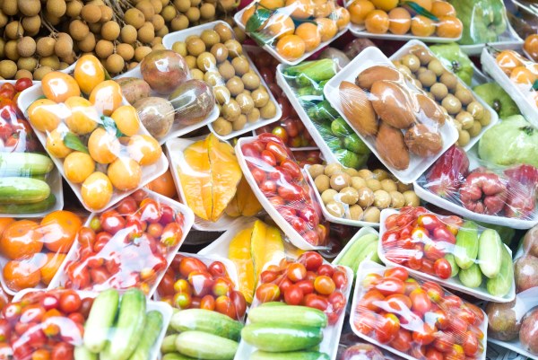 Fresh produce covered in degradable polythene film